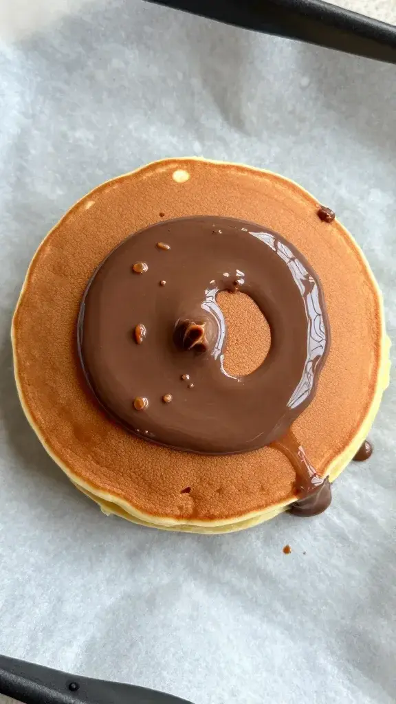 top view frozen Nutella pancake disk on parchment paper